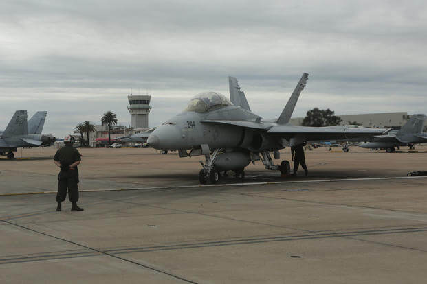 A Marine with Marine Fighter Attack Training Squadron (VMFAT) 101, 3rd Marine Aircraft Wing prepares an F/A-18 Hornet for taxi at Marine Corps Air Station Miramar, Calif., March 21, 2017. (U.S. Marine Corps photo/Lance Cpl. Liah Kitchen)