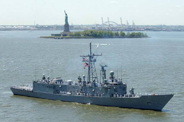 The Oliver Hazard Perry-class guided missile frigate USS Boone (FFG-28) sails past the Statue of Liberty in the Hudson River during the kickoff of Fleet Week 2002. (U.S. Navy/Michael W. Pendergrass)