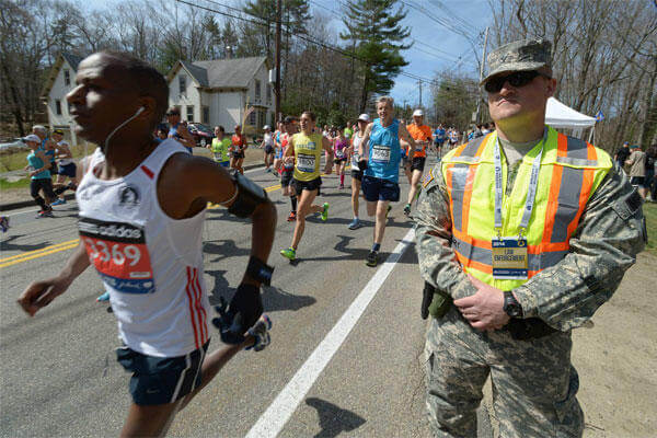 Army Spc. Brandon Smith, 169th Military Police Company, Rhode Island Army National Guard, at the starting line of the 2014 Boston Marathon, April 21, 2014. U.S. Army photo by Staff Sgt. Jerry Saslav