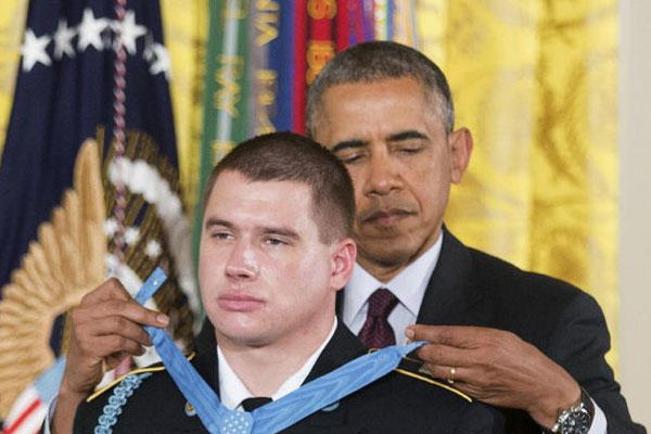 President Barack Obama awards the Medal of Honor to former Army Sgt. Kyle J. White during a ceremony in the East Room of the White House in Washington, Tuesday, May 13, 2014. (AP Photo)