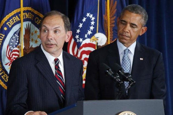 President Barack Obama listens as former Procter and Gamble executive Robert McDonald, his nominee as the next Veterans Affairs secretary, speaks at the Department of Veterans Affairs in Washington, Monday, June 30, 2014. (AP Photo/Charles Dharapak)