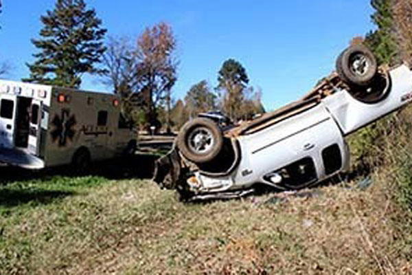 Marines with Bravo Company, 1st Battalion, 23rd Marine Regiment, 4th Marine Division, were the first on the scene of this overturned truck Nov. 26, 2014. (Photo By: Scott Flowers)