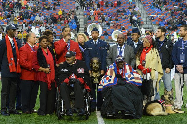 Tuskegee Airmen Homer Hogues and Calvin Spann receive the Omar N. Bradley "Spirit of Independence Award" on behalf of all of the Tuskegee Airmen Dec. 27, 2014. (U.S. Air Force photo/Senior Airman Joseph A. Pagán Jr.)