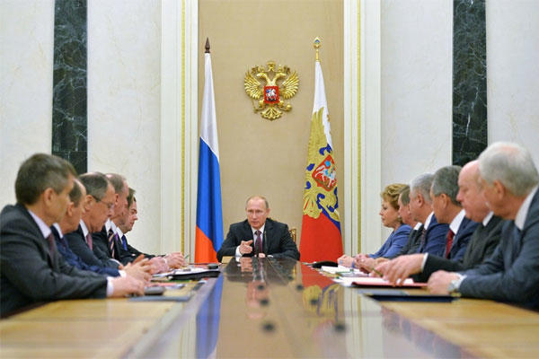 Russian President Vladimir Putin, center, heads the Security Council in Moscow's Kremlin, Russia on Friday, Dec. 26, 2014. (Alexei Druzhinin, RIA Novosti/PPS/AP)