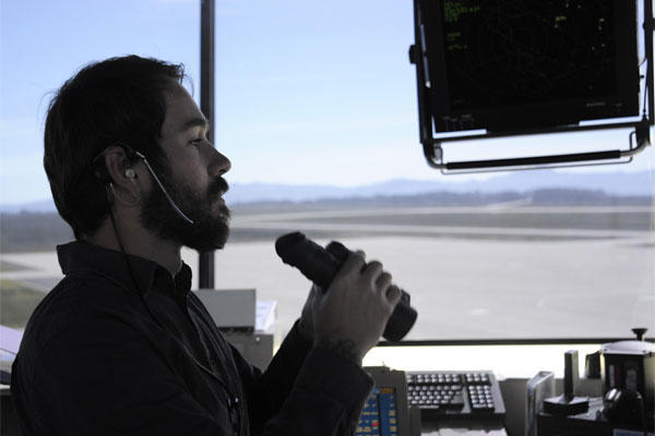 Robert Moore scans the runway for foreign objects from the control tower Feb. 2, 2015, at Vandenberg Air Force Base, Calif. (U.S. Air Force photo/Airman 1st Class Ian Dudley)