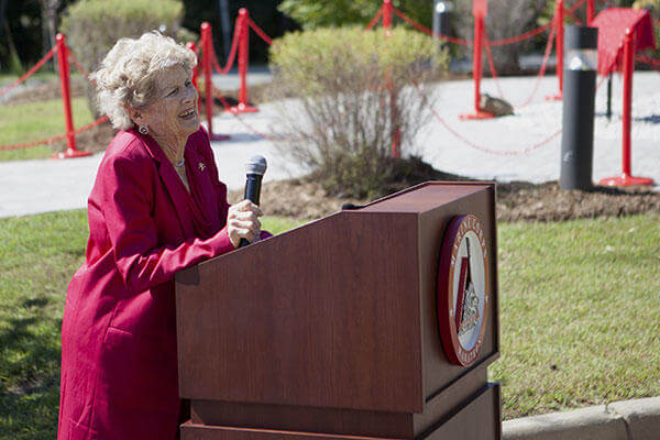 Betsy Fowler, widow of Col. James Fowler founder of the Marine Corps Marathon, speaks at the Marine Corps Marathon building dedication at Marine Corps Base Quantico, Virginia, Sept. 14, 2015. (U.S. Marine Corps/Sgt. Melissa Karnath)