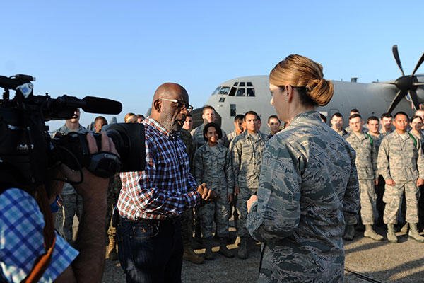 Al Roker speaks with Col. Michele Edmondson, the 81st Training Wing commander, following Roker’s weather report during a segment of the Today Show on the flightline at Keesler Air Force Base, Miss. Nov. 11, 2015. (U.S. Air Force/Kemberly Groue)