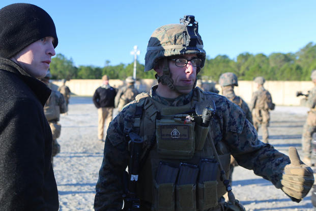 Staff Sgt. Michael Cucinotta, a platoon sergeant with 2nd Battalion, 2nd Marine Regiment, gives instructions to a refugee role player during a noncombatant evacuation training operation at Marine Corps Base Camp Lejeune, North Carolina, Jan. 14, 2016. (Ph