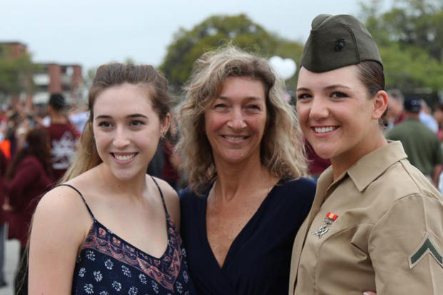 Marine Corps Pfc. Dayle M. Taber, embraces her mom and sister after her graduation ceremony at Marine Corps Recruit Depot Parris Island, S.C., April 1, 2016. (Courtesy photo)