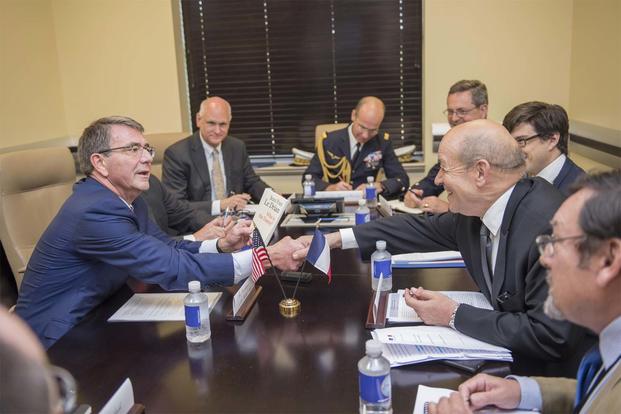Ash Carter shakes hands with French Defense Minister Jean-Yves Le Drian at a meeting of defense ministers from the coalition to counter ISIS at Joint Base Andrews, Md., July 20, 2016. (DoD photo by Air Force Tech. Sgt. Brigitte N. Brantley)