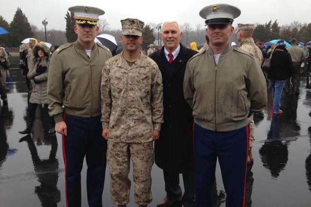 Indiana Gov. Mike Pence joins his son, Marine 2nd Lt. Michael J. Pence, second from left, during Michael Pence's Officer Candidate School graduation aboard Marine Corps Base Quantico, Virginia, March 20, 2015. Sgt Tyler S. Mitchell/Marine Corps