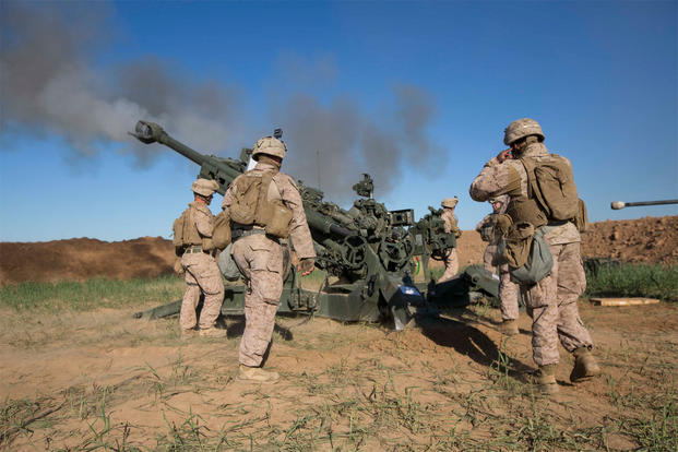 U.S. Marines with Task Force Spartan, 26th Marine Expeditionary Unit (MEU), fire a M777A2 Howitzer on an ISIS infiltration route in support of Operation Inherent Resolve, on Fire Base Bell, Iraq, March 18, 2016. (U.S. Marine Corps photo/Cpl. Andre Dakis)