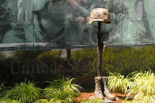 The New Hampshire Army Monument at the New Hampshire State Veterans Cemetery; the focal point of the monument is the “Battle Cross” – a bronze sculpture of combat boots, rifle and helmet. (U.S. Army photo/Staff Sgt. Nicole Dykstra)