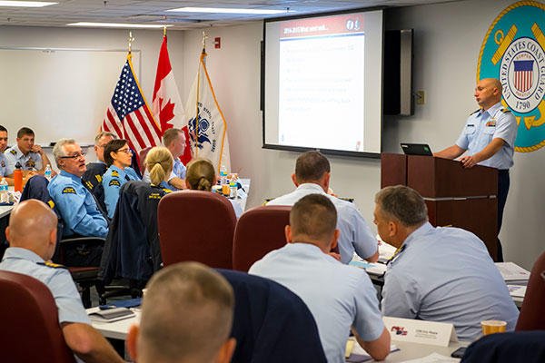 Members of the U.S. and Canadian Coast Guards discuss plans for upcoming icebreaking operations during the 2015 Great Lakes International Icebreaking Meeting held Oct. 20-21, 2015. (U.S. Coast Guard/PO3 Christopher M. Yaw)