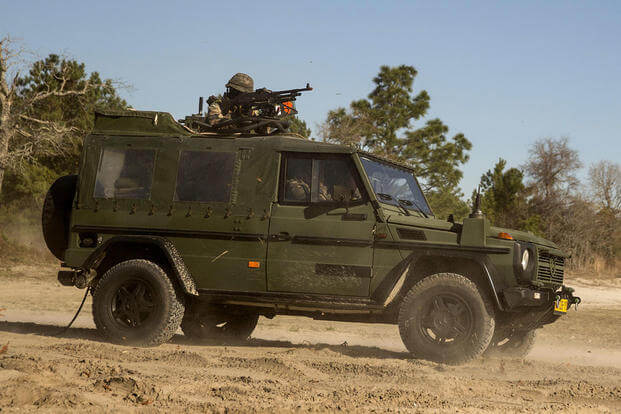 Dutch Marines with 32nd Raiding Company provide security in a Mercedes-Benz G-class utility vehicle during a casualty evacuation exercise at Marine Corps Base Camp Lejeune, North Carolina. (U.S. Marine Corps photo by Cpl. Justin Updegraff)