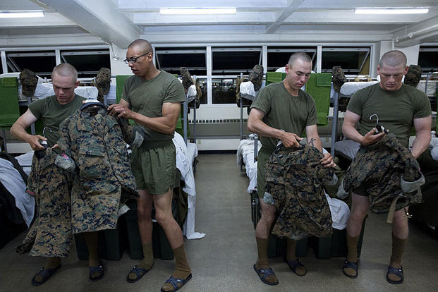 Recruits grab their woodland utilities uniform aboard Marine Corps Recruit Depot San Diego, Calif., on May 17, 2016. Lance Cpl. Erick J. ClarosVillalta/Marine Corps