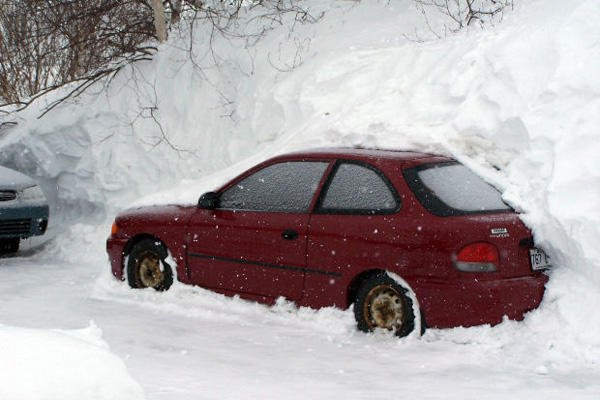Car in snowbank.