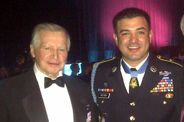 John Mohler poses with MoH recipient Army Sgt. 1st Class Leroy Petry at a 2010 Special Forces Association banquet. He claimed on his SFA application that he served with Special Forces in Vietnam. He served with the 23rd Infantry (Mechanized), 25th ID.