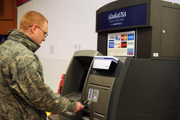 Service member using an ATM.