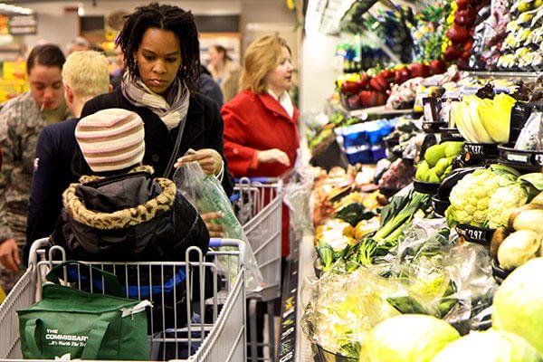 A shopper visits the produce section at the Chievres commissary in Belgium. (U.S. Army Corps of Engineers/Carol E. Davis).