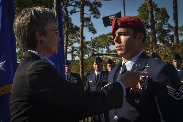 Air Force Secretary Heather Wilson pins the Air Force Cross on Staff Sgt. Richard Hunter, a Special Tactics Airman with the 23rd Special Tactics Squadron, during a ceremony Oct. 17, 2017, at Hurlburt Field, Fla. Senior Airman Ryan Conroy/Air Force