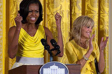 First lady Michelle Obama, accompanied by Jill Biden, speaks during a Joining Forces event in honor of military mothersin the East Room of the White House. AP Photo/Carolyn Kaster