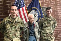 Spc. Justin Stinnett (left) and Spc. Casey Brandle (far right) share a photo op with David Hamilton in Owensboro, Ky., March 19, 2018. Stinnett and Brandle are credited with saving Hamilton from an auto accident in flood waters in Owensboro Feb. 27. (U.S. Army National Guard photo/ Brooklynd Decker)
