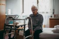 Senior sitting alone in nursing home