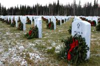 Volunteers place wreaths at Fort Richardson National Cemetery