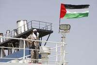 Houthi soldier stands on board of the Israeli Galaxy ship which was seized by the Houthis