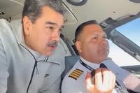 In this image made from a video posted on the Facebook account of Venezuelan President Nicolás Maduro on Dec. 15, 2023, Maduro stands behind pilot Gen. Bitner Villegas in the cockpit of an airplane. (AP Photo) US Maduro Pilot