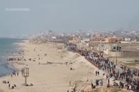 Palestinians in Central Gaza Wait for Aid Trucks to Roll off Pier Built by US