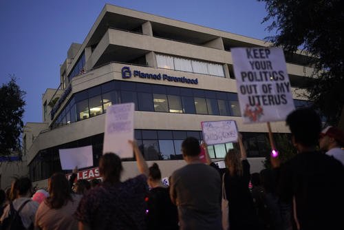 Supporters of abortion rights cheer outside a Planned Parenthood clinic