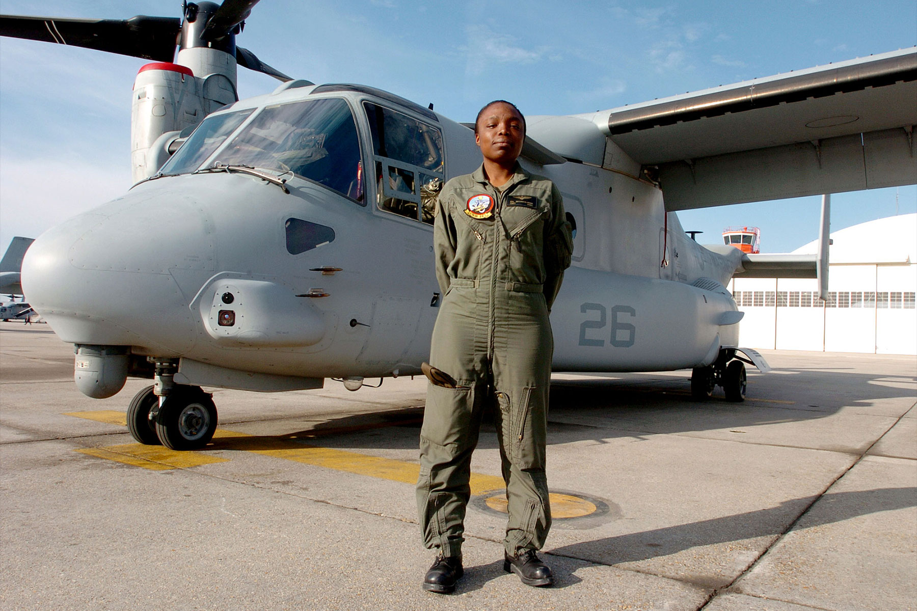 Marine Corps Captain Elizabeth A. Okoreeh-Baah poses in front of an MV-22 Osprey, March 14, 2006. (U.S. Marine Corps/Jonathan A. Tabb)