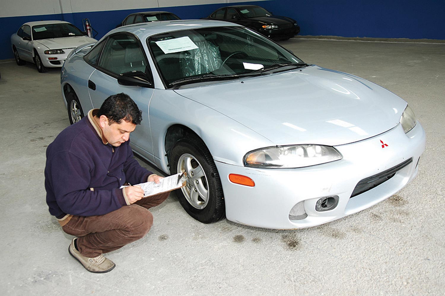 Large parking lot of new cars waiting for delivery and export, at