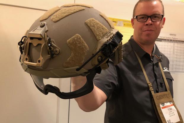 Tom Short of Gentex holds the company’s new Fast SF helmet at SHOT Show 2018. (Hope Hodge Seck/Military.com) 