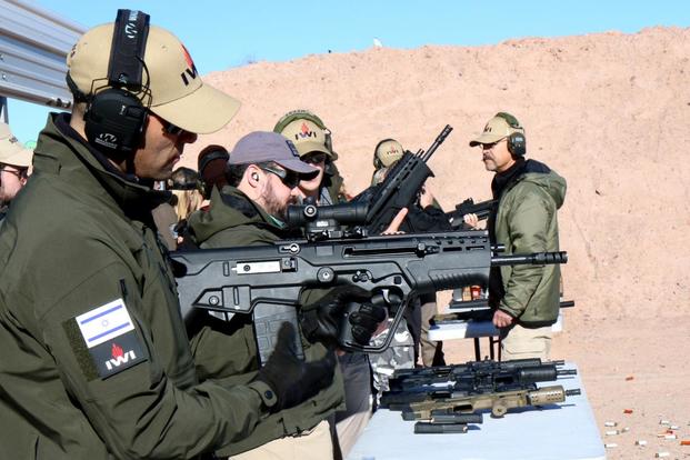 Man tests the IWI US Tavor 7 rifle chambered for 7.62mm at range day during SHOT Show 2018. (Matthew Cox/Military.com)