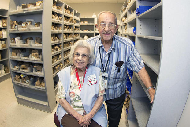 Carmen Lopez and retired U.S. Air Force Master Sgt. Luis Lopez, pose for a photo inside the pharmacy at David Grant USAF Medical Center at Travis Air Force Base, California. (U.S. Air Force/T.C. Perkins Jr.)
