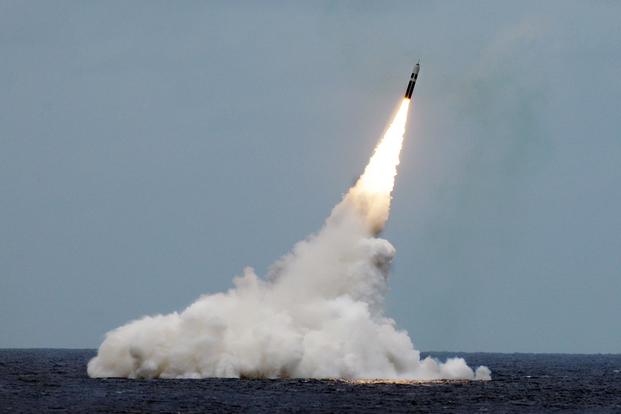 FILE PHOTO -- An unarmed Trident II D5 missile launches from the Ohio-class fleet ballistic-missile submarine USS Maryland (SSBN 738) off the coast of Florida. (U.S. Navy/ John Kowalski)