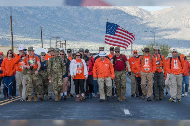 100-year-old Bataan Death March survivor Col. Ben Skardon (in white hat), a beloved Clemson University alumnus and professor emeritus, walked between 6.5 and 7 miles in the Bataan Memorial Death March at White Sands Missile Range, N.M., March 25, 2018. (Photo: U.S. Army/Ken Scar)