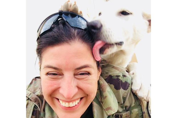 Erby the dog lays a kiss on Sgt. Tracy McKithern, a combat photographer from Tampa, Florida with the 982nd Combat Camera Co. (Airborne), in the Kurdistan Training Coordination Center (KTCC), near Erbil, Iraq, Nov. 7, 2017. (U.S. Army photo/Tracy McKithern)