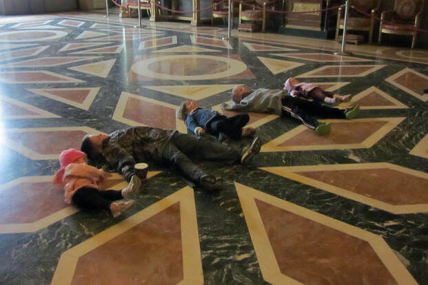 Five of the six Vankirk children lay on the Caserta Palace museum’s floor. (Courtesy of Patrick Vankirk)