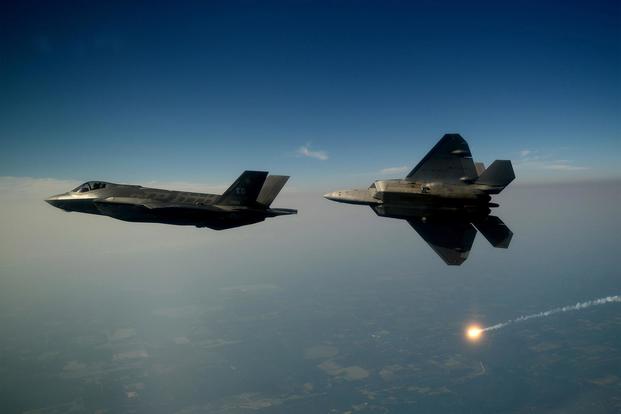 An F-35A Lightning II joint strike fighter from the 33rd Fighter Wing at Eglin Air Force Base, Fla., and an F-22A Raptor from the 43rd Fighter Squadron at Tyndall Air Force Base, Fla., soar over the Emerald Coast Sept. 19, 2012. (U.S. Air Force/Master Sgt. Jeremy T. Lock)