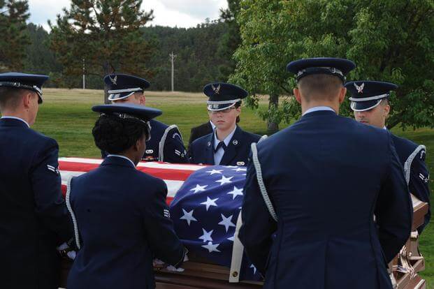 Airmen from the Ellsworth Air Force Base’s Honor Guard move the casket of a retiree during a funeral at Black Hills National Cemetery in Sturgis, S.D., Sept. 26, 2017. (U.S. Air Force/Airman Nicolas Z. Erwin)