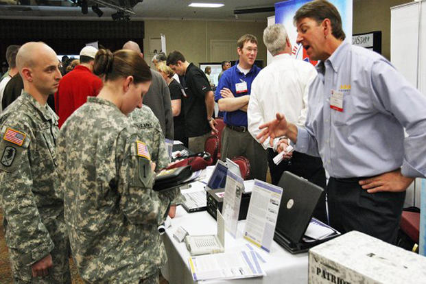Soldiers meet with civilian recruiters at a recent job fair at Fort Huachuca, Arizona.