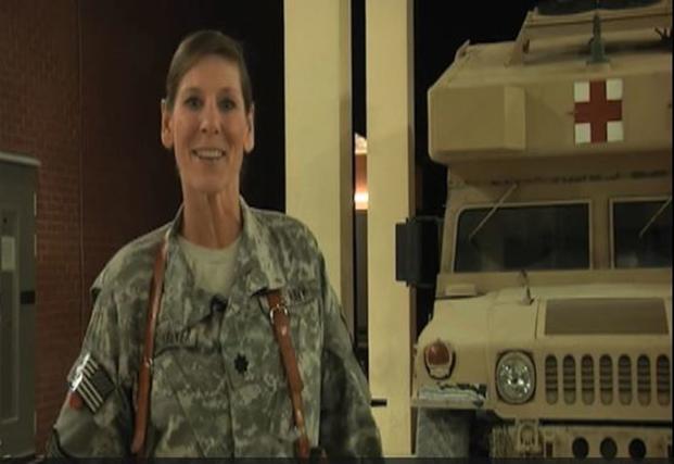 A screenshot from a 2011 video shot in Kandahar, Afghanistan shows then-Navy Cmdr. Lynne Blankenbeker sending Christmas greetings to family back home. Blankenbeker is now running for Congress in New Hampshire. (DVIDS)