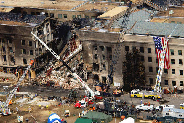 An aerial view of the damage at the Pentagon two days after Sept. 11, 2001. On that day, five members of al-Qaida, a group of fundamentalist Islamic Muslims, hijacked American Airlines Flight 77, a Boeing 757-200, from Dulles International Airport just outside Washington and flew the aircraft and its 64 passengers into the side of the Pentagon. (Air Force photo by Tech. Sgt. Cedric H. Rudisill)