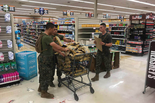 Marines help salvage products at the Camp Lejeune, North Carolina commissary after Hurricane Florence. (Marine Corps/Brian Ehrlich)