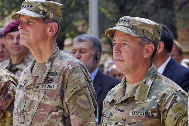 U.S. Army Gen. Joseph Votel, U.S. Central Command commander, left, and Gen. Scott Miller, incoming Resolute Support Mission commander, stand as the NATO Hymn is played during the Resolute Support mission change of command ceremony in Kabul, Afghanistan, on Sept. 2, 2018. (U.S. Air Force photo by Tech. Sgt. Sharida Jackson)