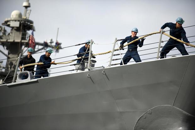 Sailors heave a mooring line aboard the Arleigh Burke-class guided-missile destroyer USS Preble (DDG 88) as it departs Naval Base San Diego for a scheduled underway. (U.S. Navy/Mass Communication Specialist 3rd Class Carlos M. Vazquez II)